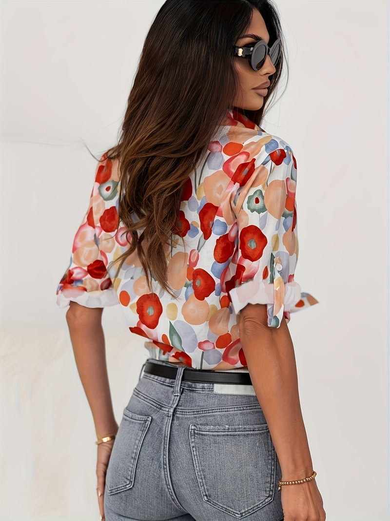 Close-up of the Poppy blouse watercolor floral print and spread collar button-down placket detail