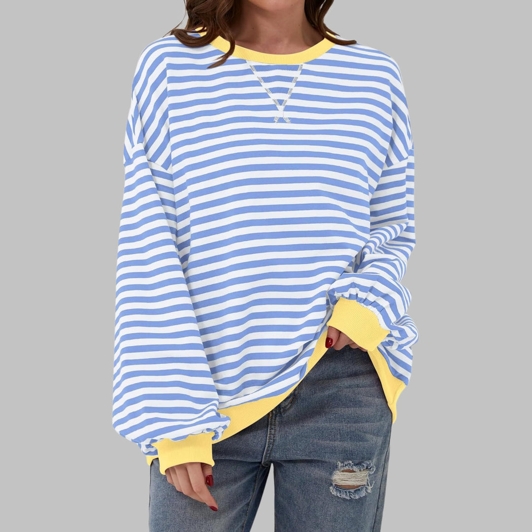 Close-up of contrast ribbed collar and cuffs on the Poppy striped sweatshirt