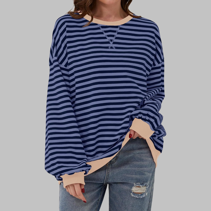 Poppy striped sweatshirt in Pink colorway laid flat on a light background