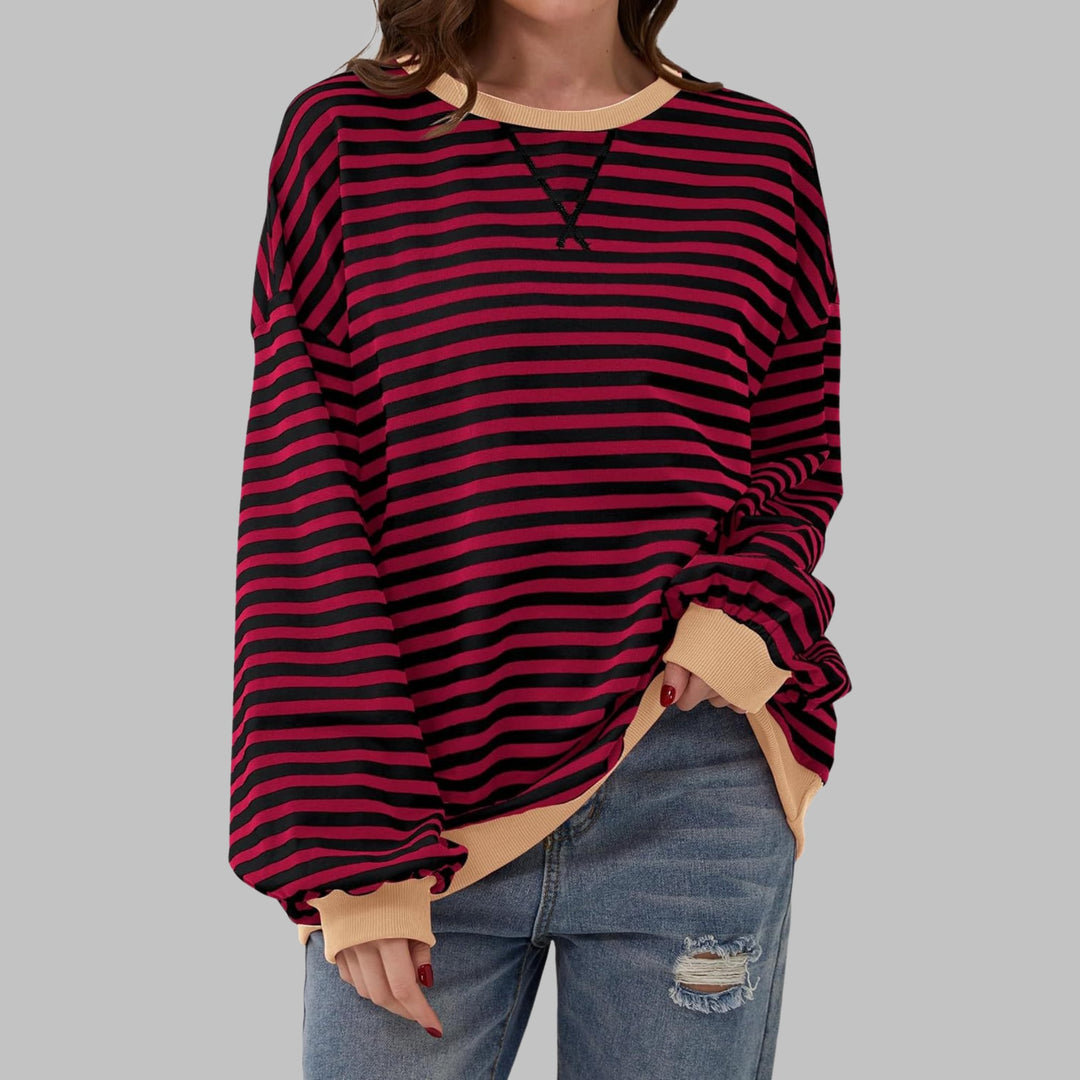 Poppy striped sweatshirt in Black colorway worn by a model facing forward