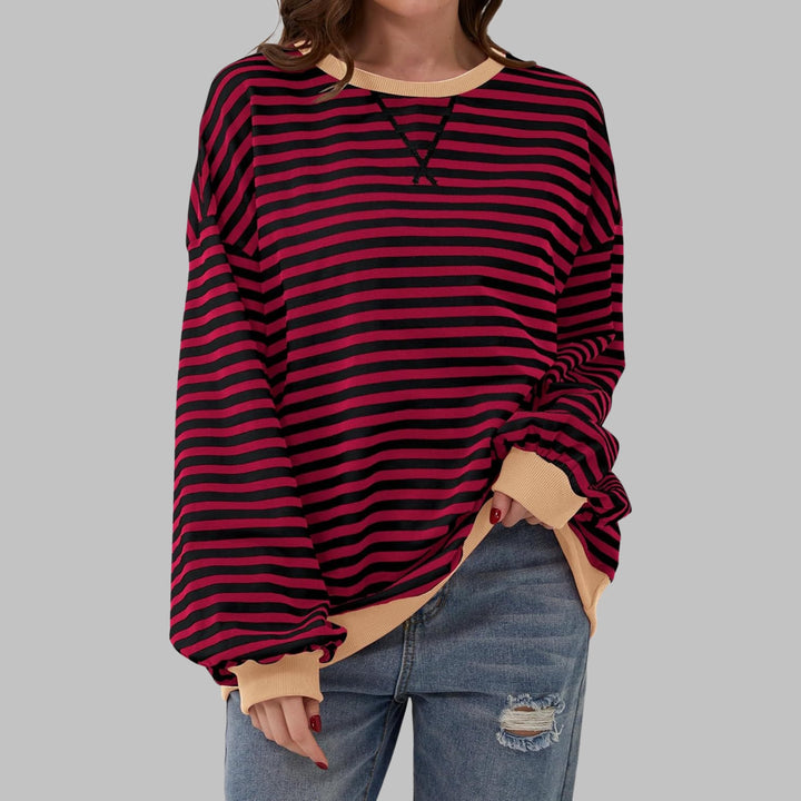 Poppy striped sweatshirt in Black colorway worn by a model facing forward