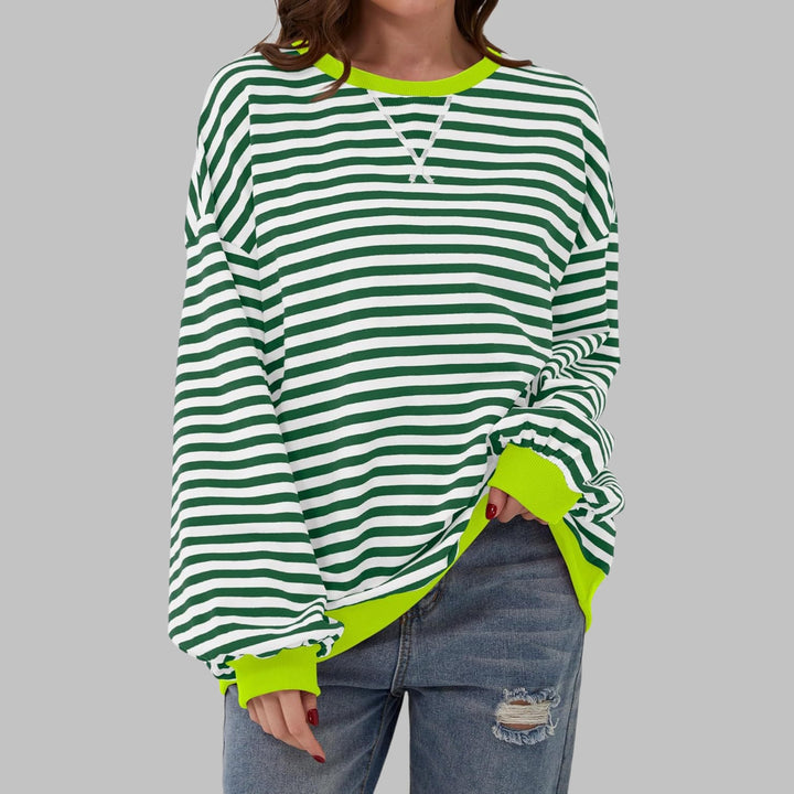 Flat lay of the Poppy striped oversized sweatshirt showing full length and sleeve detail