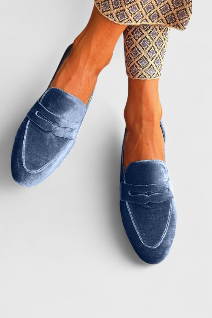 Side profile view of the Portia blue flat loafers highlighting the classic slip-on silhouette