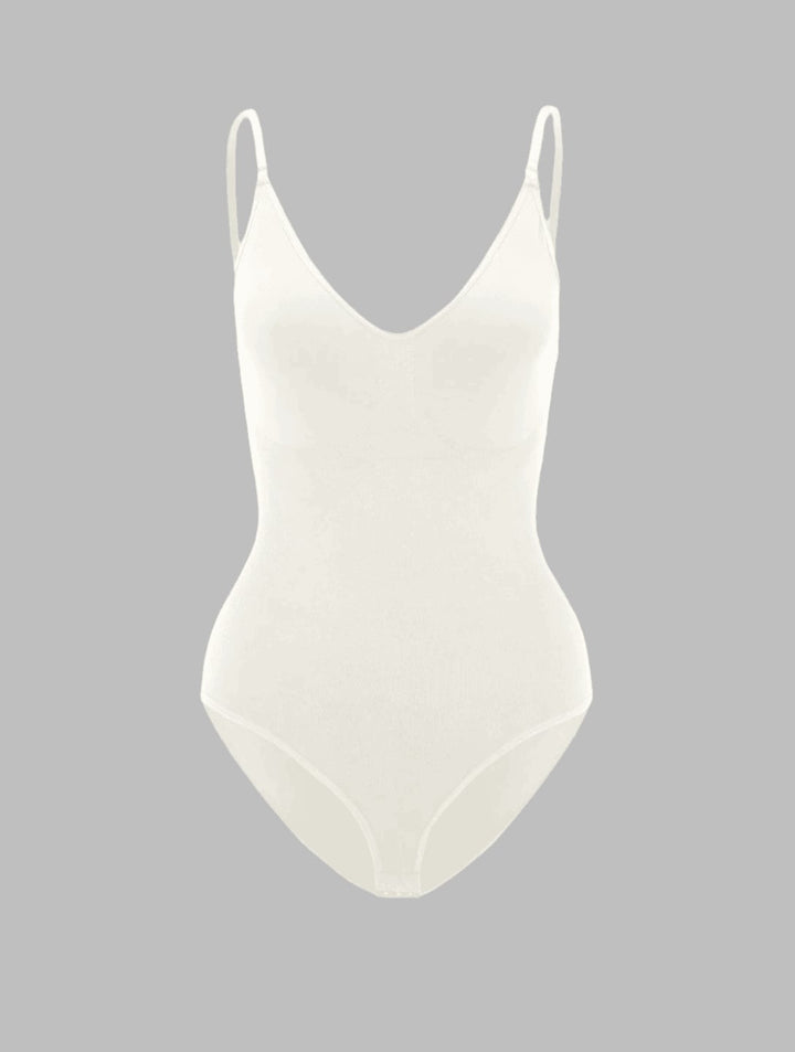 Model in the PowerSculpt shapewear bodysuit in purple showing waist-cinching and curve-enhancing fit