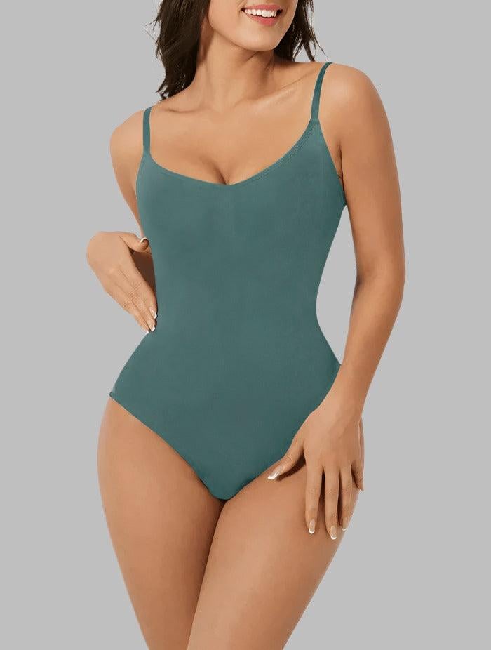 Model in the PowerSculpt bodysuit in black with jeans showing how it layers under everyday outfits