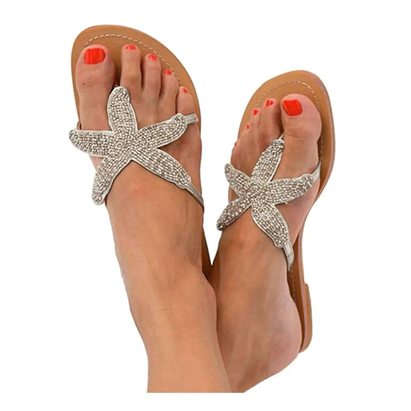 Primrose women's slides in silver with sea star motif, front view on white background