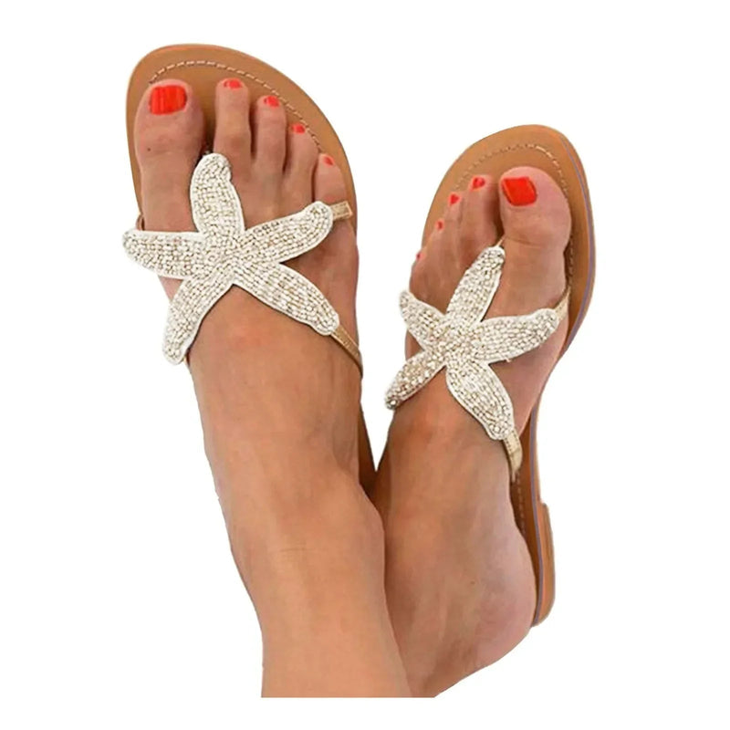 Primrose women's slides in white with cushioned sole detail, angled view