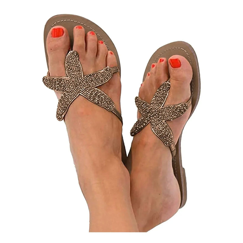 Primrose women's slides in rose gold, top-down view highlighting sea star design