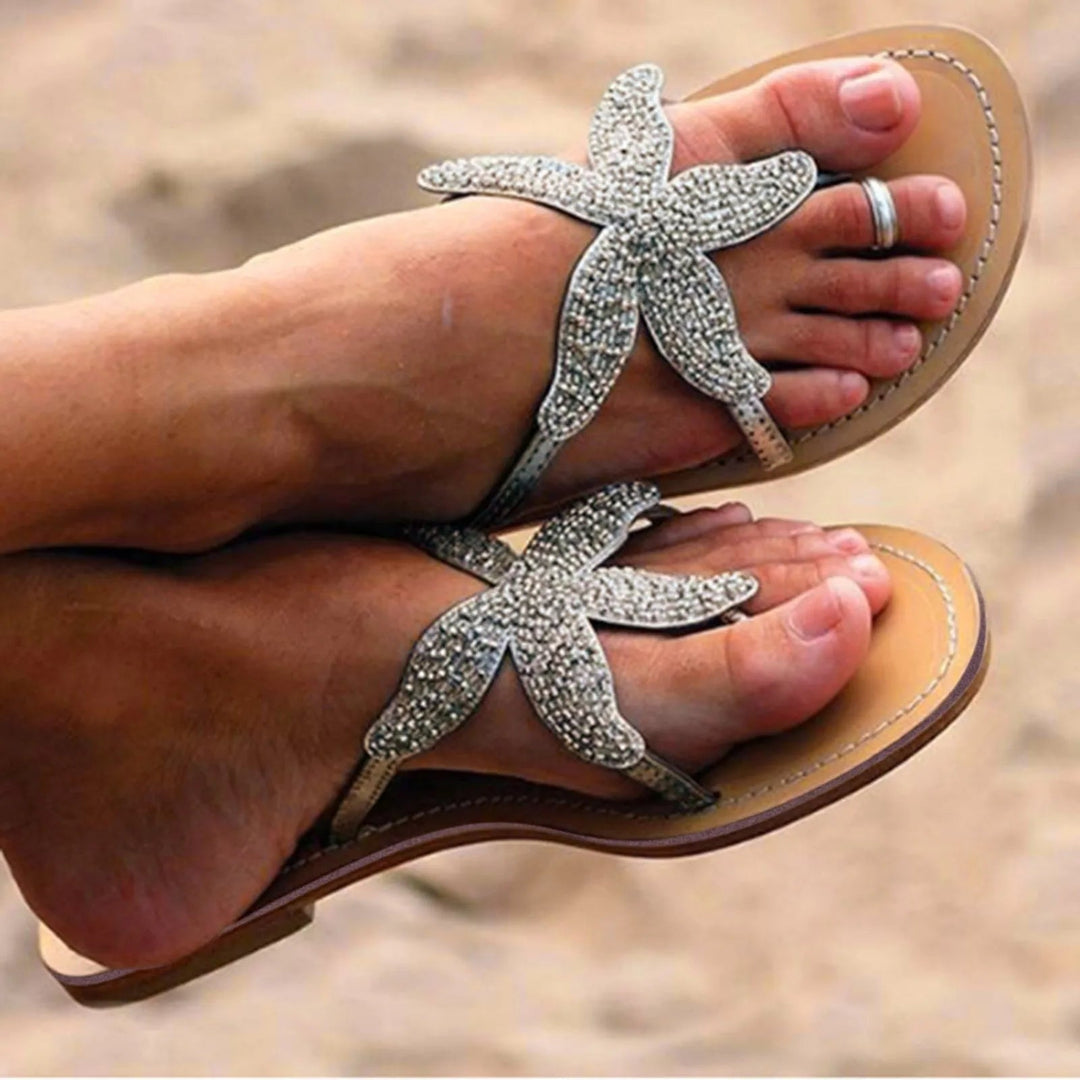 Close-up of Primrose slide sea star motif in gold colorway