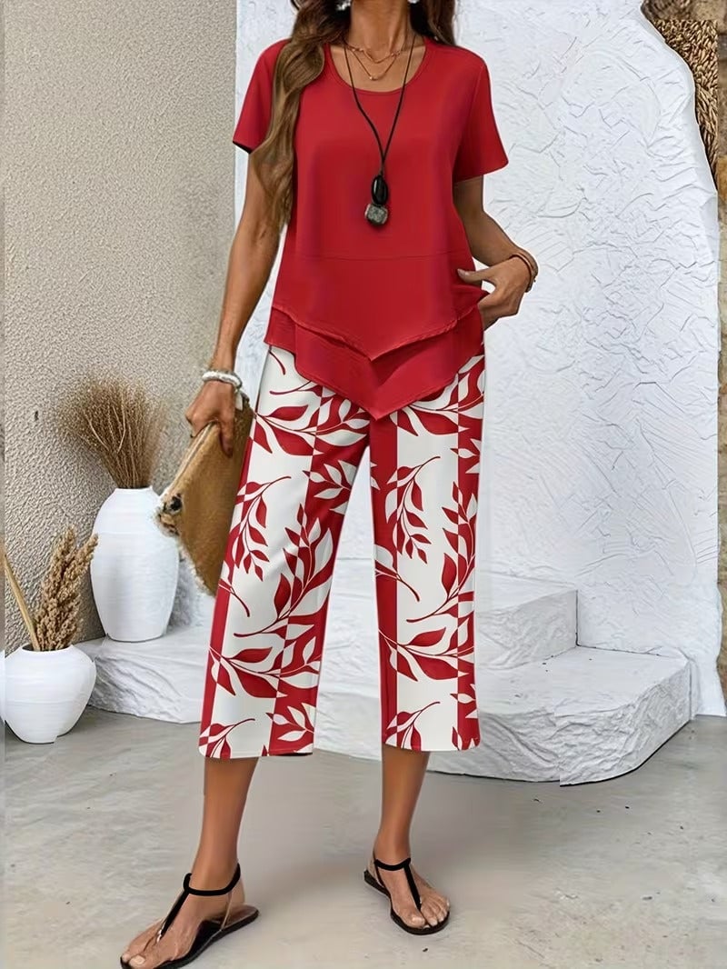 Women's botanical print two piece set in red, showing relaxed fit top and matching leaf print pants