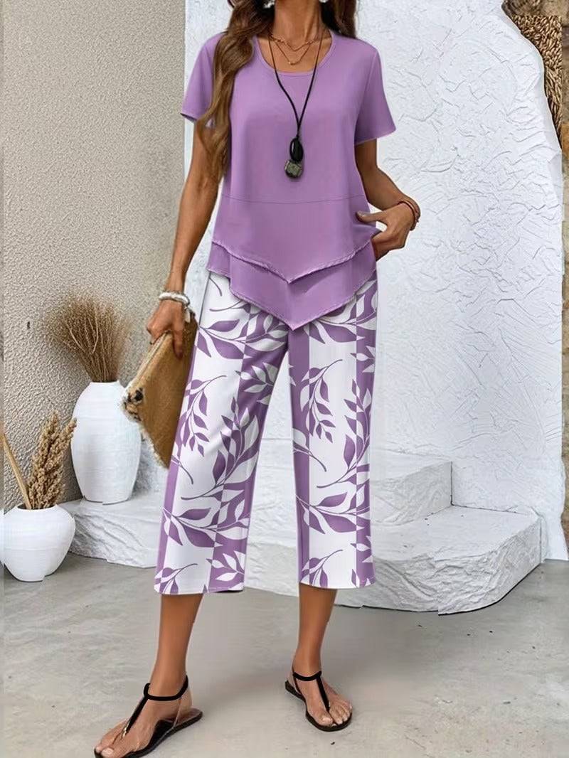 Light blue women's two piece set featuring short-sleeve solid top and leaf print relaxed pants