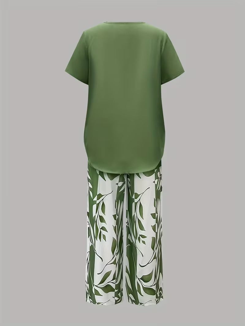 Model wearing green leaf print two piece set, full-length front view showing relaxed silhouette