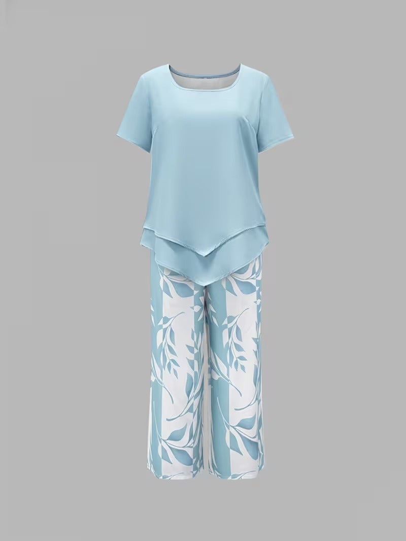 Back view of women's leaf print two piece set in purple, highlighting relaxed fit pants