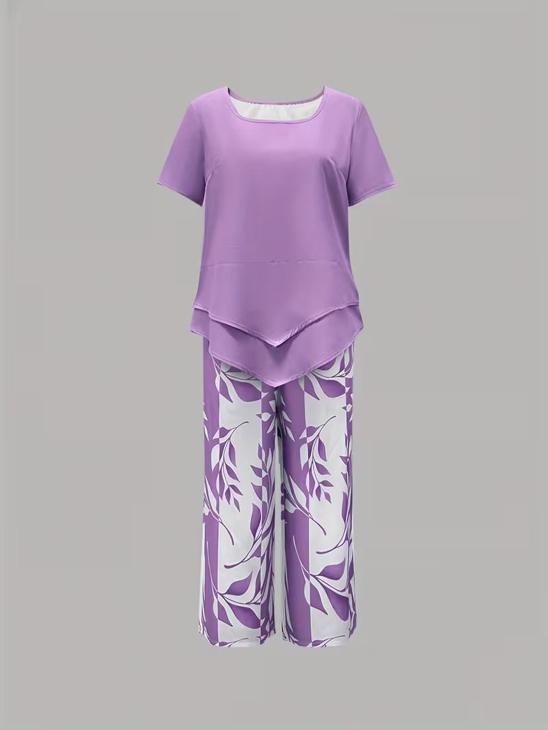 Side view of light blue botanical print two piece set showing short sleeve top and pant length