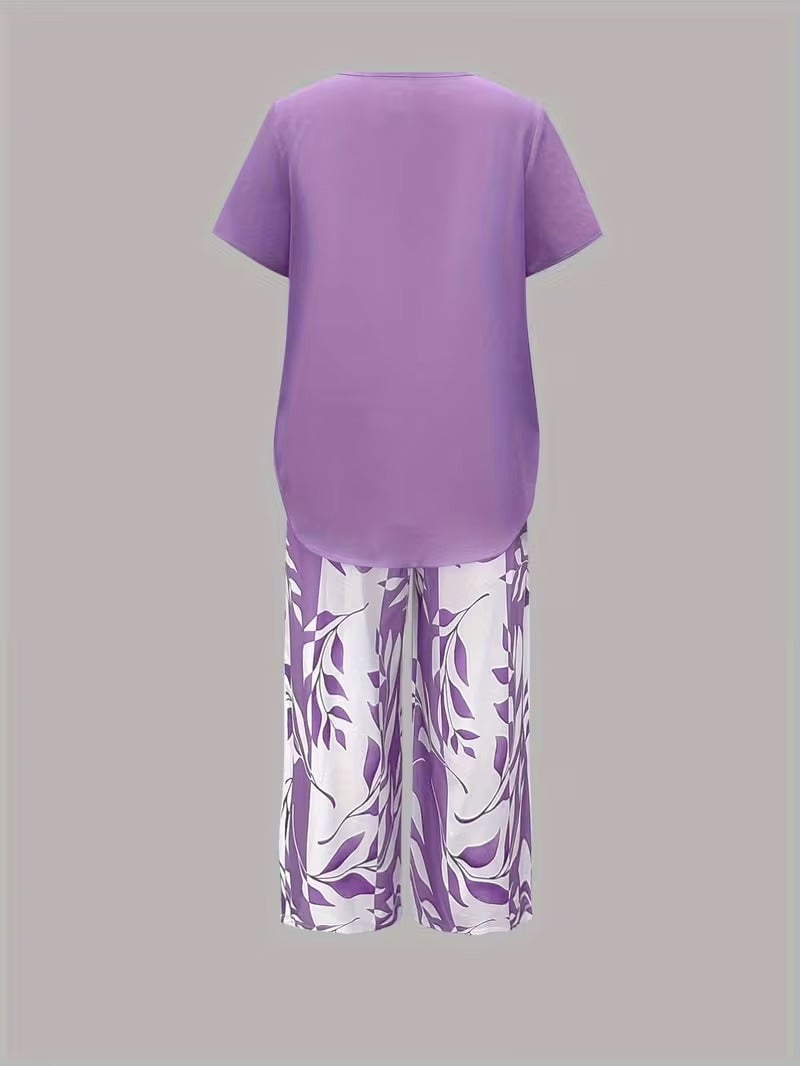 Flat lay of women's leaf print two piece set in green displaying top and pants together