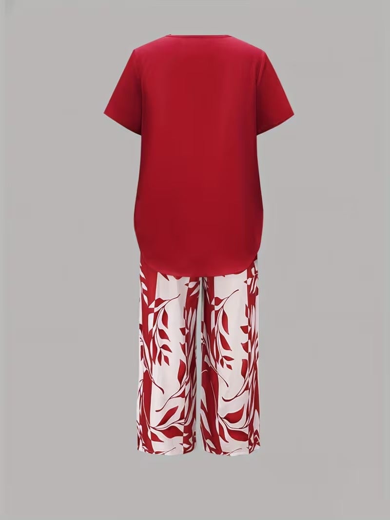 Group of women's leaf print two piece sets in all four colors: green, purple, red, and light blue