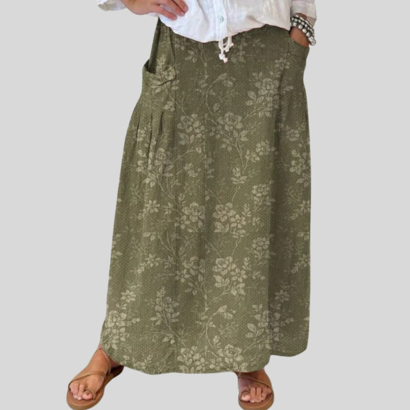 Flat lay of the vintage floral skirt displaying the elastic waistband and all-over floral pattern