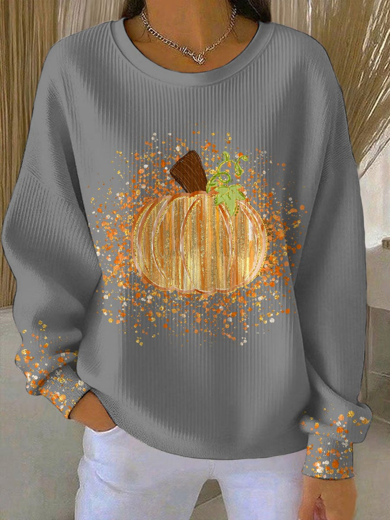 Flat lay of the pumpkin art sweatshirt in white showing the full seasonal print and relaxed silhouette