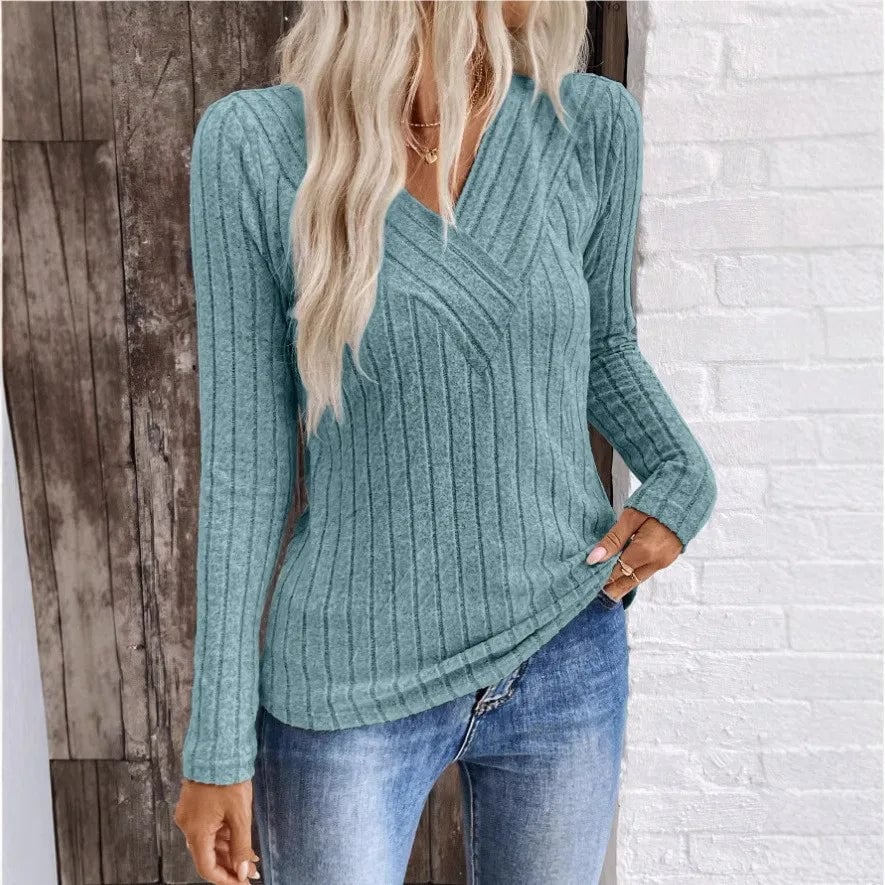Woman wearing a Florimay elegant sunken stripe sweater in peacock blue with a relaxed, flattering fit