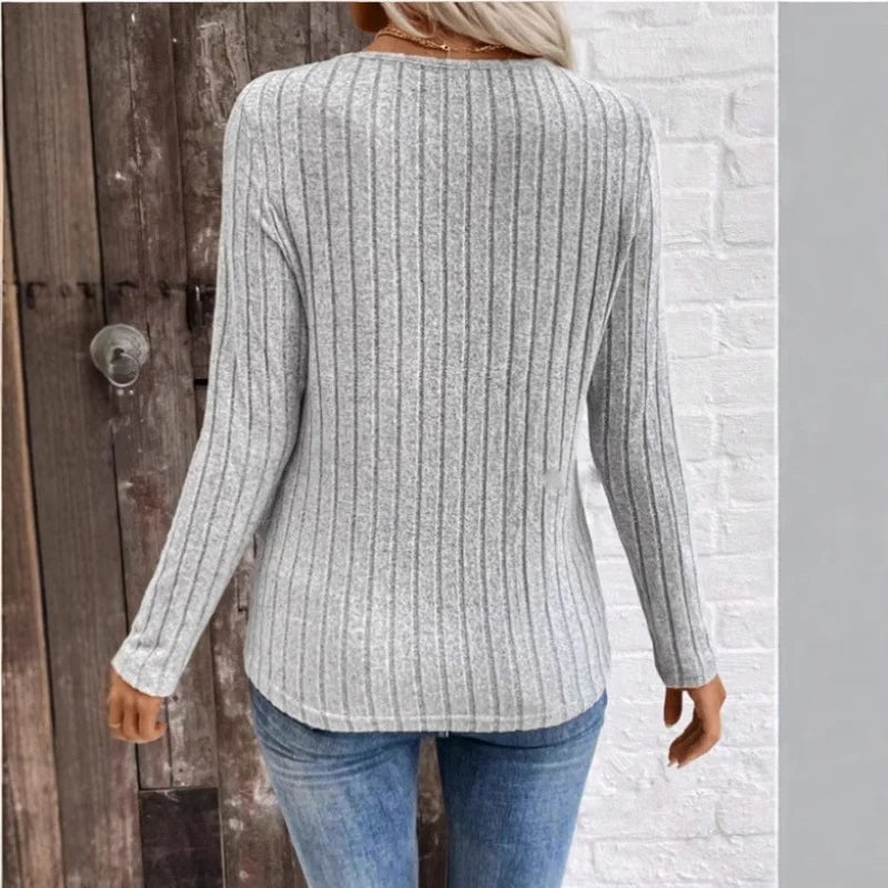 Flat lay of the Florimay sunken stripe sweater in peacock blue, black, and gray color options