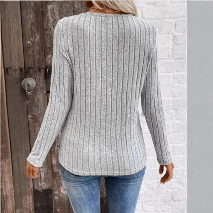 Flat lay of the Florimay sunken stripe sweater in peacock blue, black, and gray color options