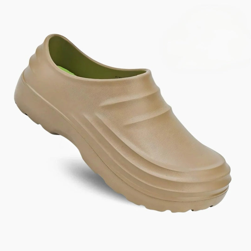 Quinn women's sandals in brown showing contoured footbed detail, side view