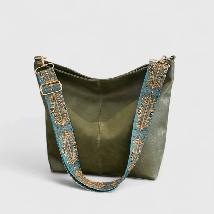 Side view of the Ragnelle shoulder bag highlighting its structured silhouette