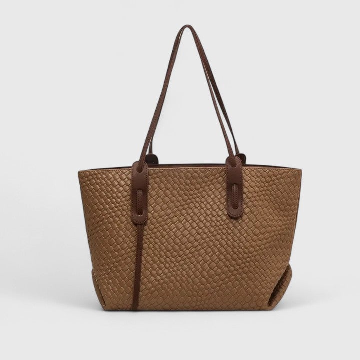 Close-up of the woven texture detail on a beige tote bag