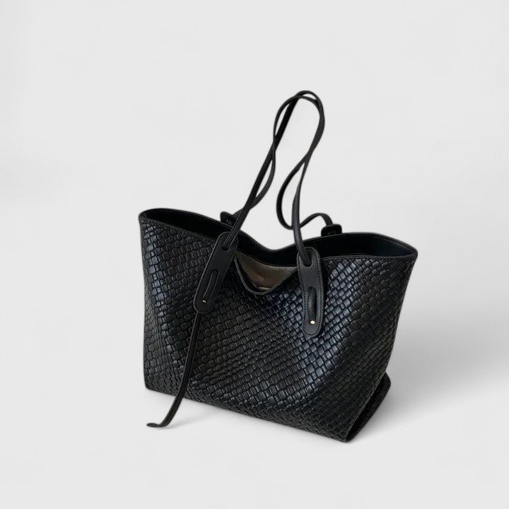 Coffee brown woven tote bag shown from the side angle