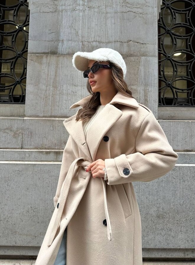 Detail shot of the Ramona coat buttons and collar accent stitching