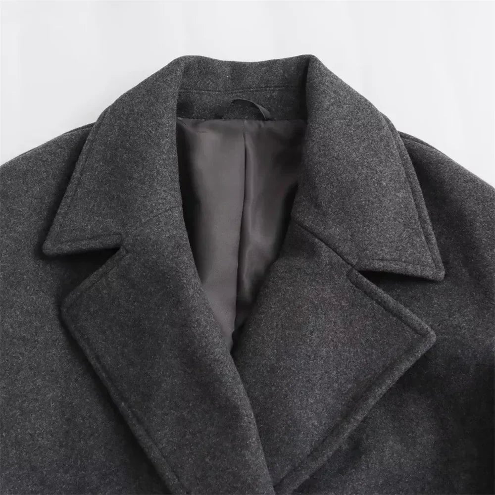 Close-up of the Ramona coat hem and sleeve cuffs showing polished finishing details