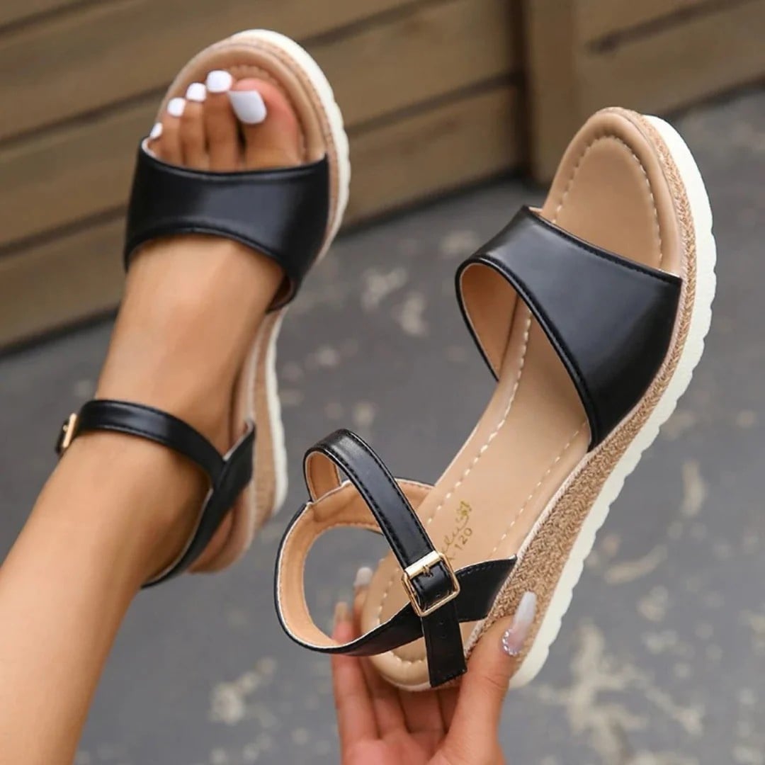 Ramona sandals in beige styled with a flowy dress on a woman, lifestyle shot