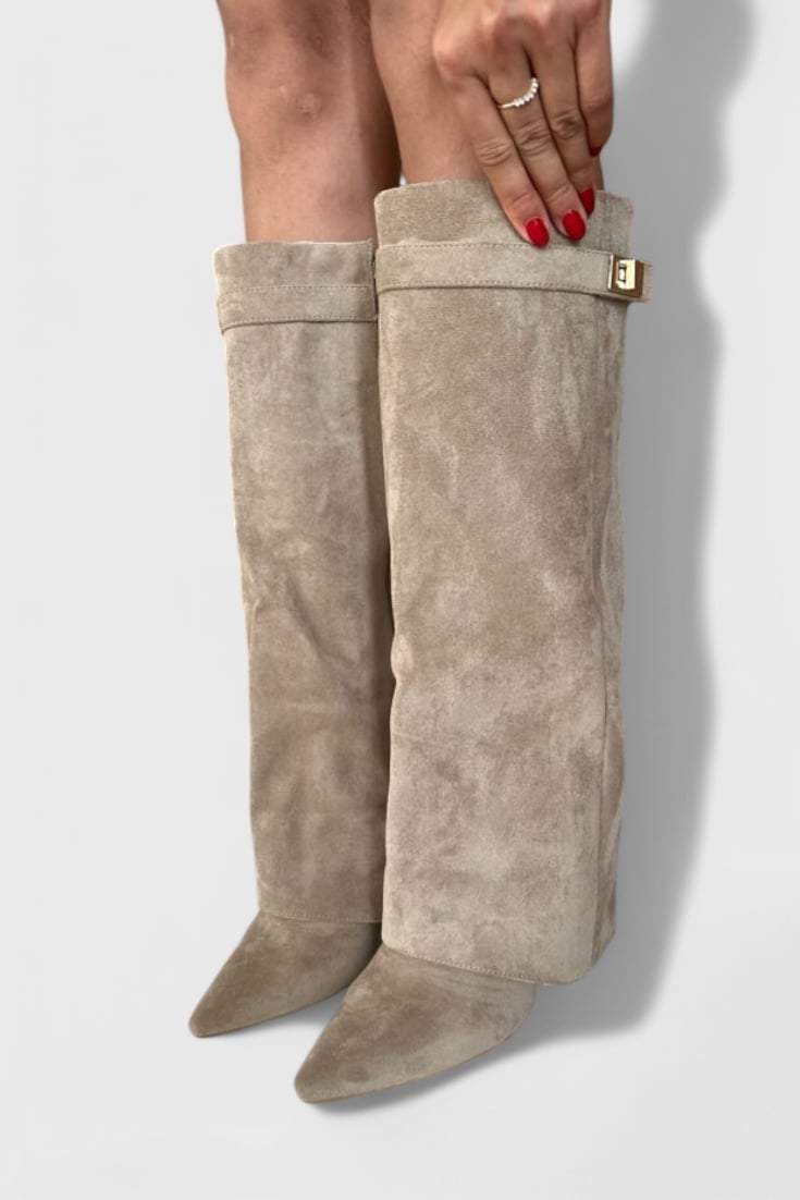 Pair of Raya sleek boots in beige laid flat on a light surface, top-down view
