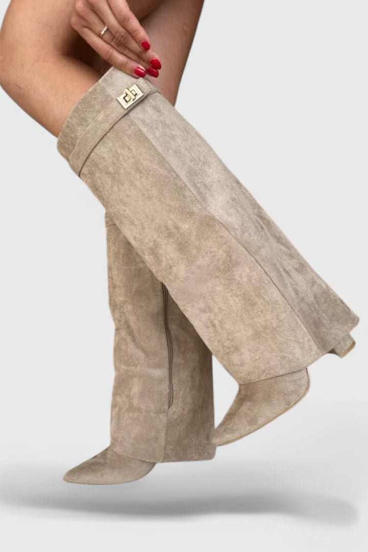 Woman wearing Raya boots in apricot with a midi skirt, full-length lifestyle shot