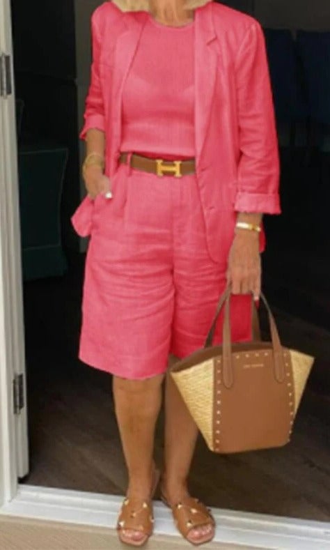 Women wearing the Reagan blazer and shorts set in pink, side profile view