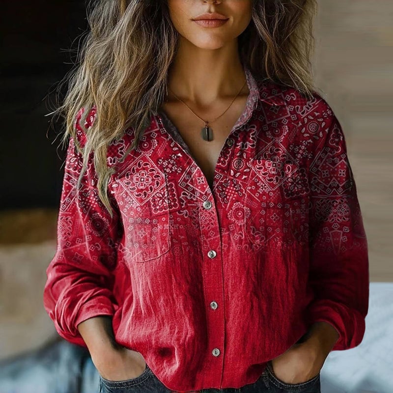 Model wearing a bohemian vintage blouse with intricate floral print and flare sleeves in a relaxed fit