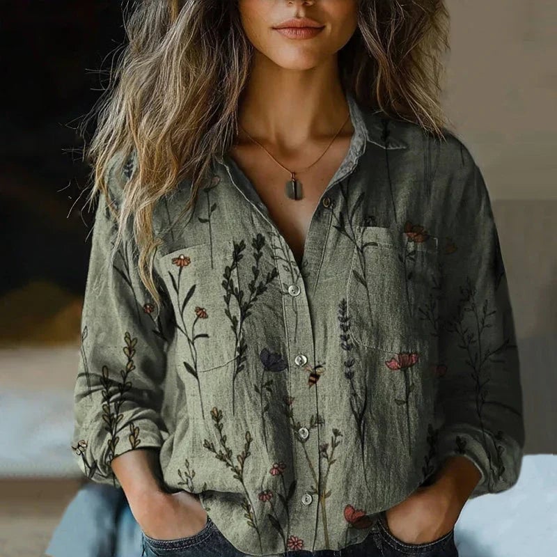 Close-up of bohemian vintage blouse showing detailed pattern print and flowing fabric texture