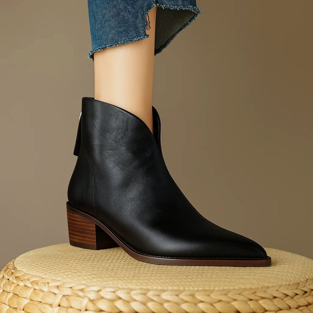 Close-up of the sole and heel of Rebecca ankle boots in black