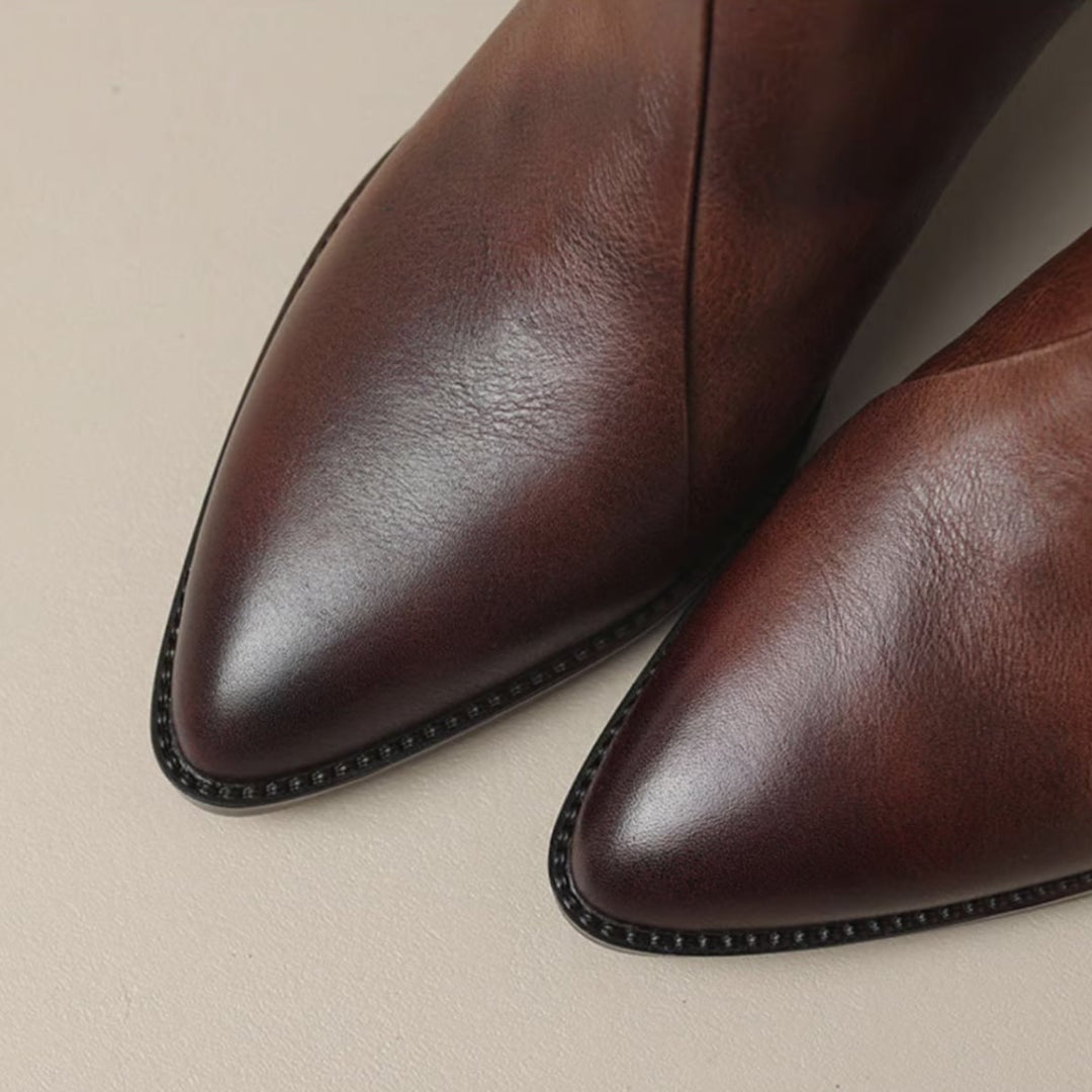 Detail shot of the leather finish on Rebecca ankle boots in brown