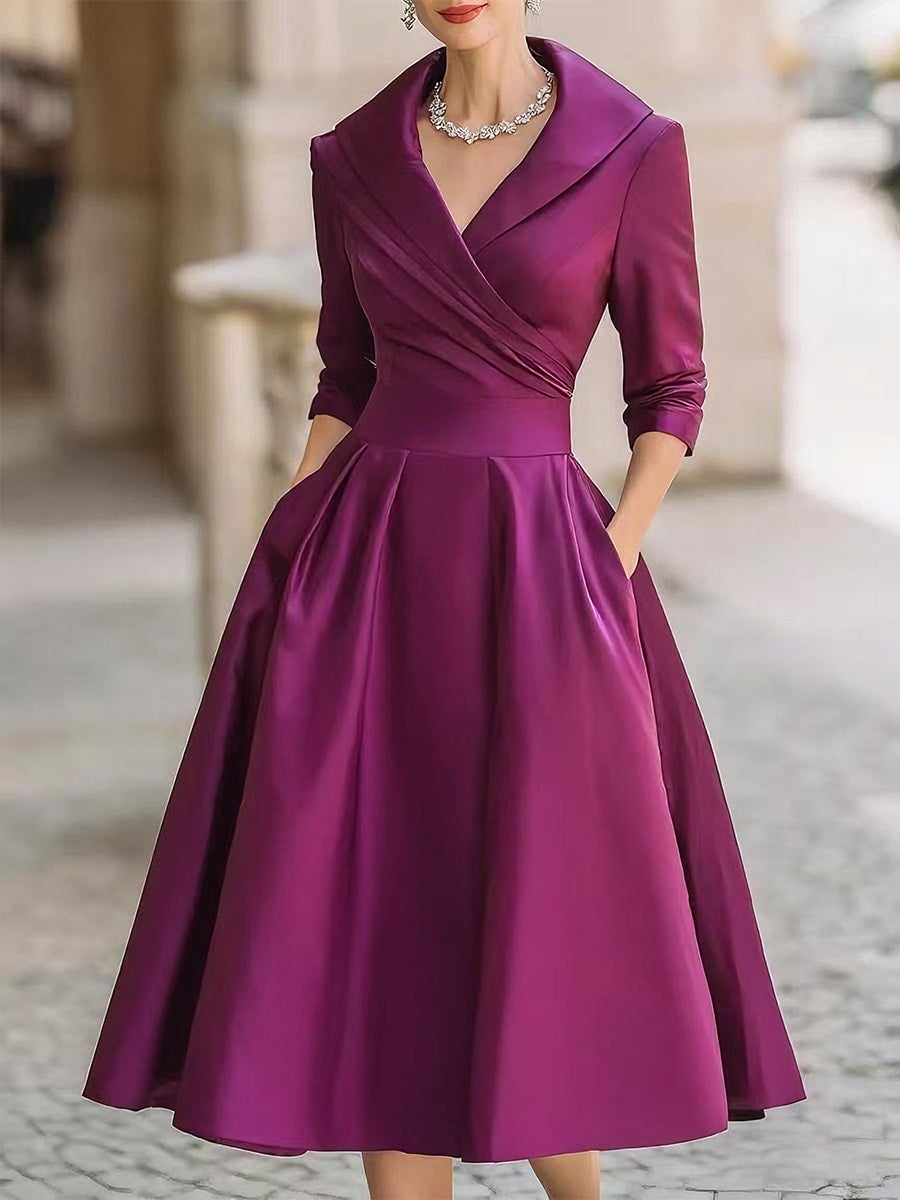 Side profile of the Reece midi dress highlighting the elongating midi length and graceful drape