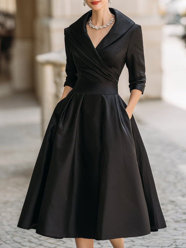 Detail shot of the Reece midi dress fabric showing its soft, lustrous finish