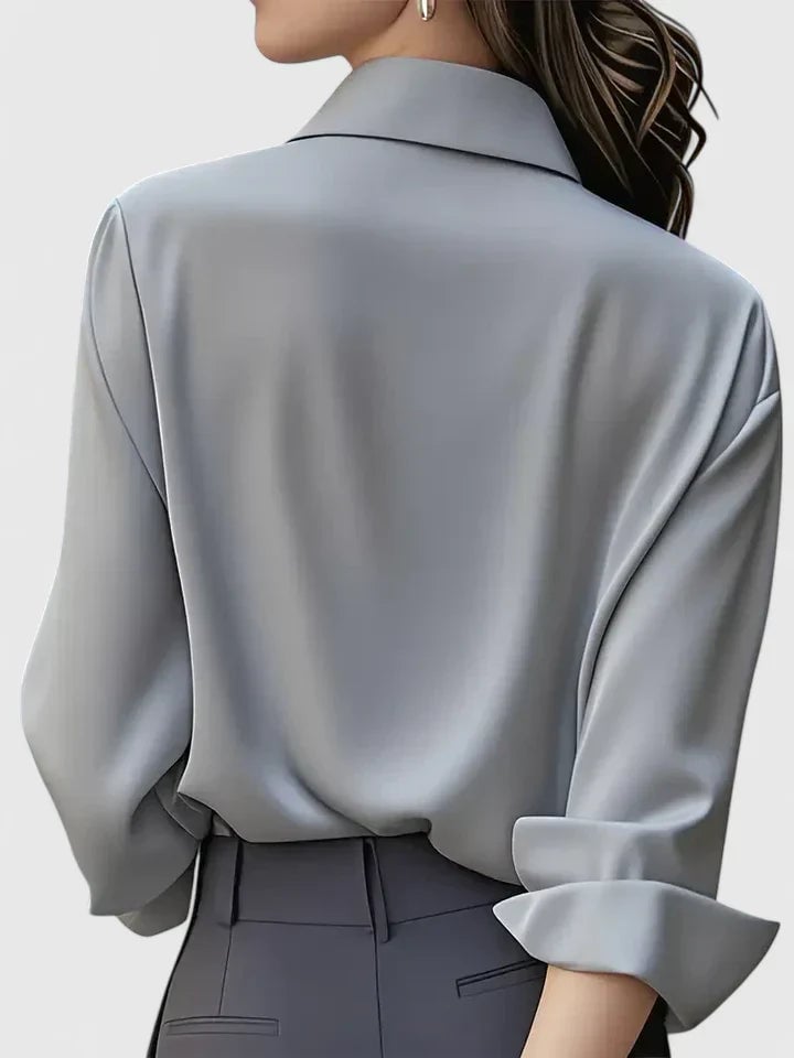Flat lay of all four color options of the Reese satin button-down shirt: navy blue, white, black, and gray