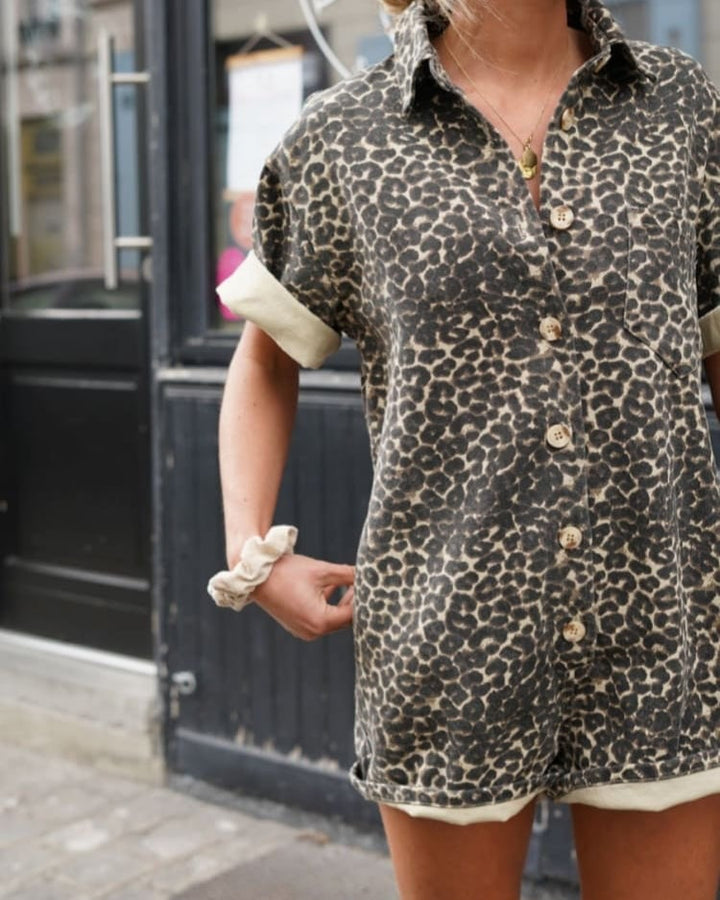 Back view of a leopard print shirt-style playsuit with relaxed silhouette