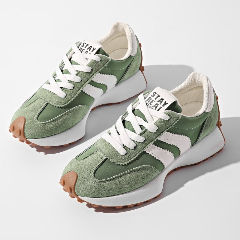 Reeve retro platform sneakers in green with white contrast stripe paneling and chunky gum rubber sole, front view
