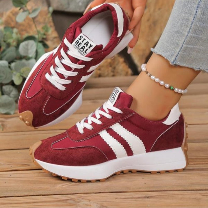 Reeve retro platform sneakers in blue, side view highlighting chunky sole and padded collar