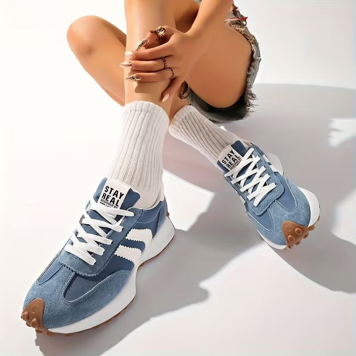 Reeve retro platform sneakers in white with white stripe detailing and gum rubber sole, front view