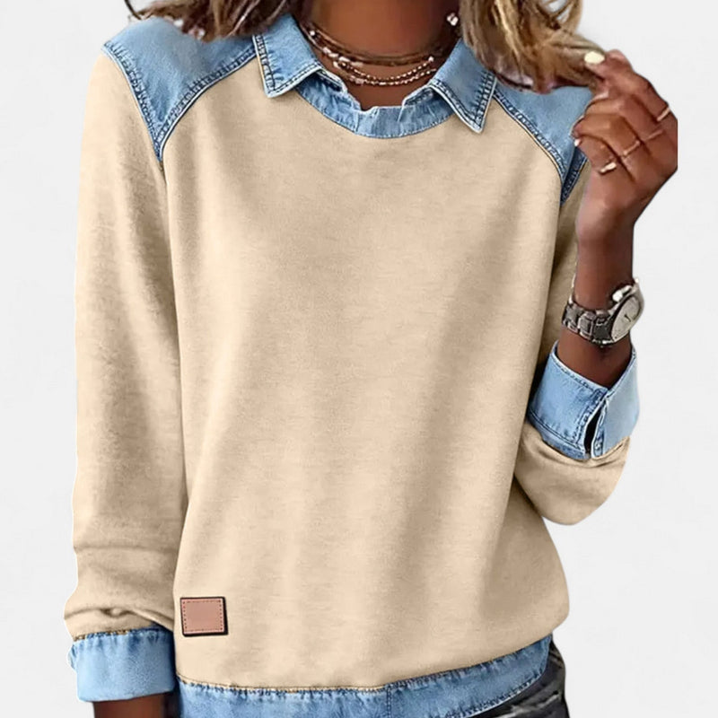 Woman in khaki Regina long sleeve sweater layered under a blazer for a polished office outfit