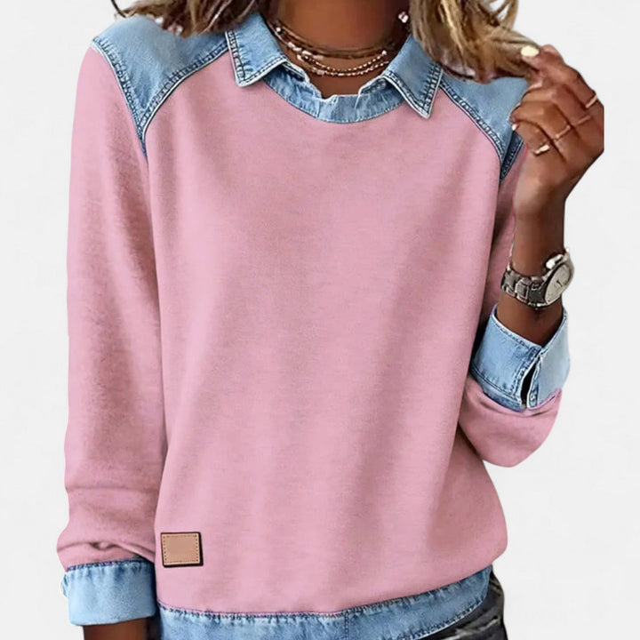 Regina long sleeve sweater in pink worn tucked into high-waist trousers for a chic minimalist style