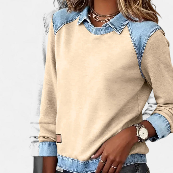 Regina long sleeve sweater in navy blue shown with jeans as an easy mix-and-match everyday outfit