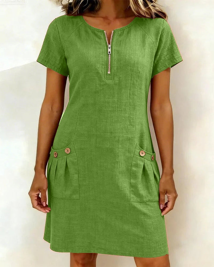 Close-up of silver zip neckline detail on the Remi shift dress